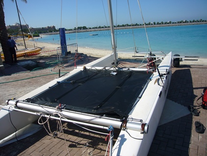 nacra 5.8 bias cut trampoline sitting on the beach